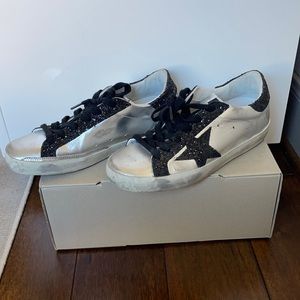 Metallic and black golden goose sneakers